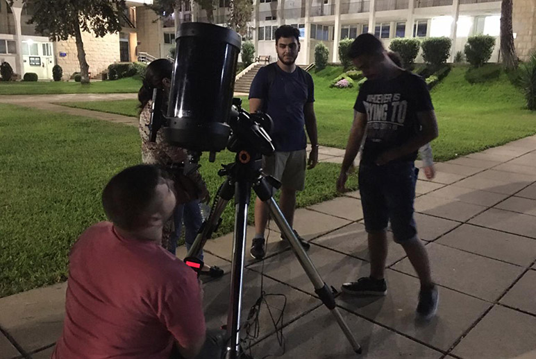 RHU Physics and Astronomy Club train on using the telescope