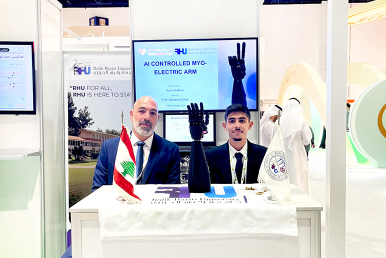 RHU Professor Mohamad Diab and student Samir Fakhour showcase RHU’s AI-controlled myoelectric prosthetic arm at AccessAbilities Expo Dubai 2026.